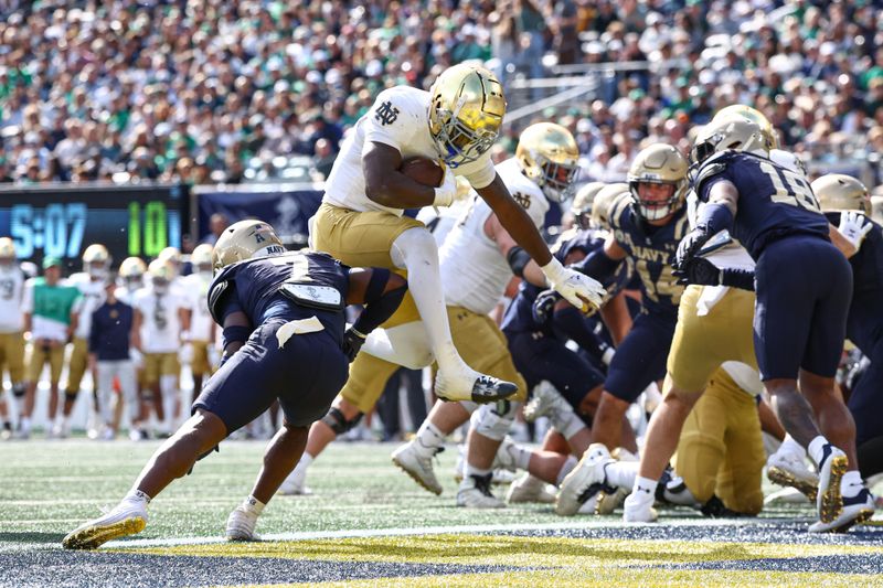 Oct 26, 2024; East Rutherford, New Jersey, USA;  Notre Dame Fighting Irish running back Jeremiyah Love (4) rushes for a touchdown during the first half against the Notre Dame Fighting Irish at MetLife Stadium. Mandatory Credit: Vincent Carchietta-Imagn Images