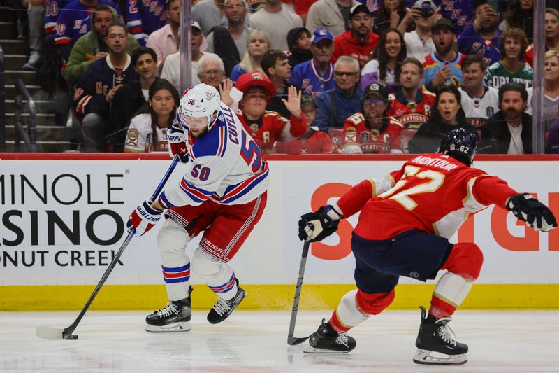 May 28, 2024; Sunrise, Florida, USA; New York Rangers left wing Will Cuylle (50) moves the puck against Florida Panthers defenseman Brandon Montour (62) during the first period in game four of the Eastern Conference Final of the 2024 Stanley Cup Playoffs at Amerant Bank Arena. Mandatory Credit: Sam Navarro-USA TODAY Sports