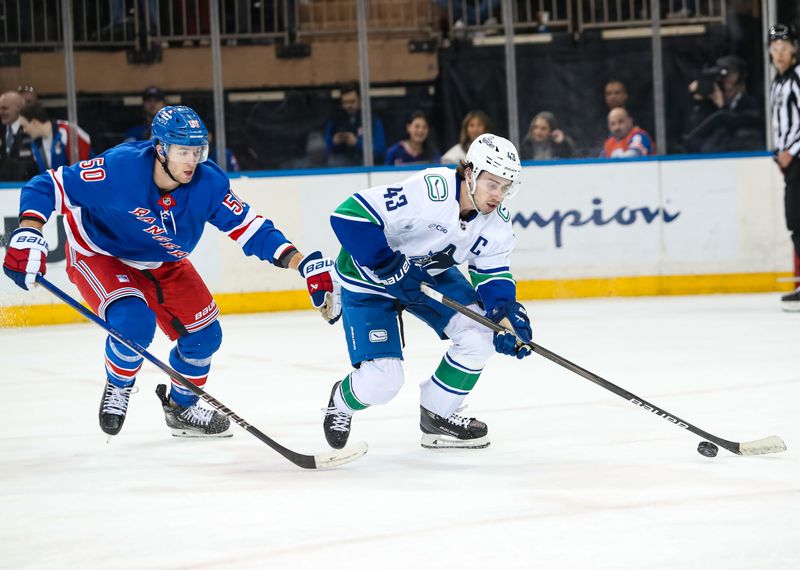 Mar 22, 2025; New York, New York, USA; New York Rangers left wing Will Cuylle (50) chases Vancouver Canucks defenseman Quinn Hughes (43) during the third period at Madison Square Garden. Mandatory Credit: Danny Wild-Imagn Images