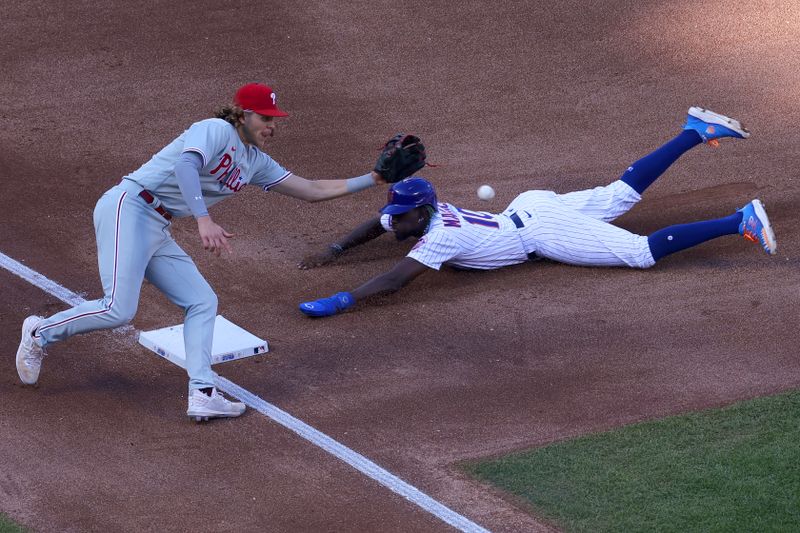 Oct 1, 2023; New York City, New York, USA; New York Mets second baseman Ronny Mauricio (10) steals third base against Philadelphia Phillies third baseman Alec Bohm (28) during the fourth inning at Citi Field. Mandatory Credit: Brad Penner-USA TODAY Sports