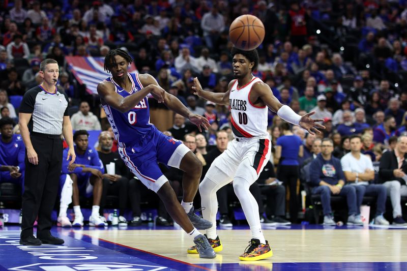 PHILADELPHIA, PENNSYLVANIA - OCTOBER 29: Tyrese Maxey #0 of the Philadelphia 76ers recovers a loose ball past Scoot Henderson #00 of the Portland Trail Blazers during the third quarter at Wells Fargo Center on October 29, 2023 in Philadelphia, Pennsylvania. NOTE TO USER: User expressly acknowledges and agrees that, by downloading and or using this photograph, User is consenting to the terms and conditions of the Getty Images License Agreement. (Photo by Tim Nwachukwu/Getty Images)