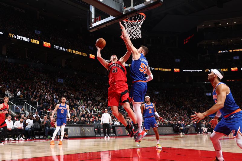 TORONTO, CANADA - MARCH 27: Kelly Olynyk #41 of the Toronto Raptor drives to the basket during the game against the New York Knicks on March 27, 2024 at the Scotiabank Arena in Toronto, Ontario, Canada.  NOTE TO USER: User expressly acknowledges and agrees that, by downloading and or using this Photograph, user is consenting to the terms and conditions of the Getty Images License Agreement.  Mandatory Copyright Notice: Copyright 2024 NBAE (Photo by Vaughn Ridley/NBAE via Getty Images)