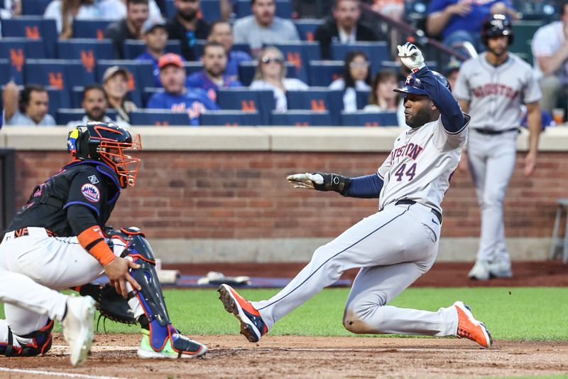 Jun 28, 2024; New York City, New York, USA;  Houston Astros designated hitter Yordan Alvarez (44) slides safely at home in the third inning against the New York Mets at Citi Field. Mandatory Credit: Wendell Cruz-USA TODAY Sports