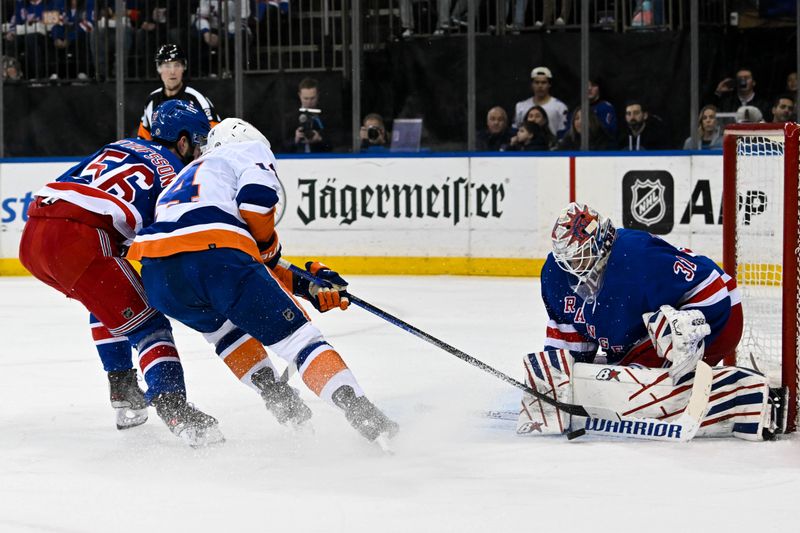 Apr 13, 2024; New York, New York, USA;  New York Rangers goaltender Igor Shesterkin (31) makes save on New York Islanders center Bo Horvat (14) during the first period at Madison Square Garden. Mandatory Credit: Dennis Schneidler-USA TODAY Sports