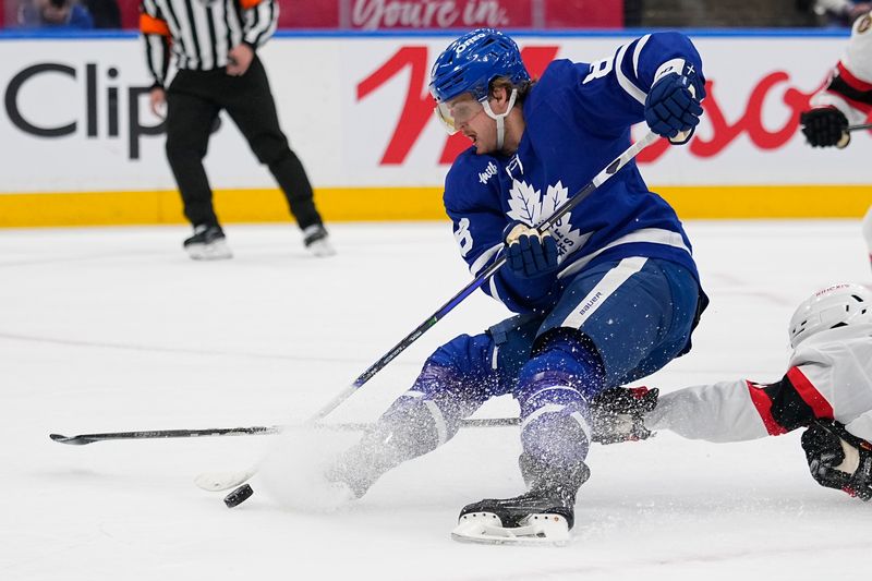 Apr 20, 2025; Toronto, Ontario, CAN; Toronto Maple Leafs forward William Nylander (88) tries to control the puck against the Ottawa Senators during the first period of game one of the first round of the 2025 Stanley Cup Playoffs at Scotiabank Arena. Mandatory Credit: John E. Sokolowski-Imagn Images