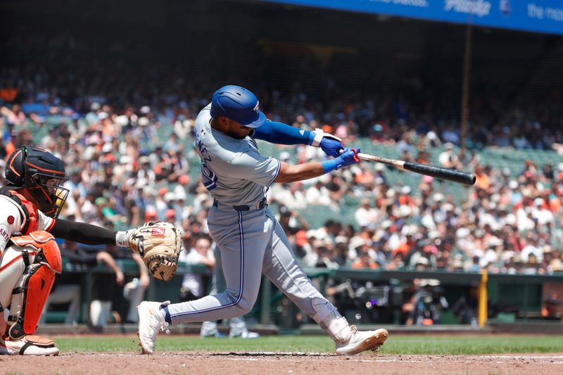 Jul 11, 2024; San Francisco, California, USA; Toronto Blue Jays shortstop Leo Jimenez (49) hits an RBI single during the fourth inning against the San Francisco Giants at Oracle Park. Mandatory Credit: Sergio Estrada-USA TODAY Sports