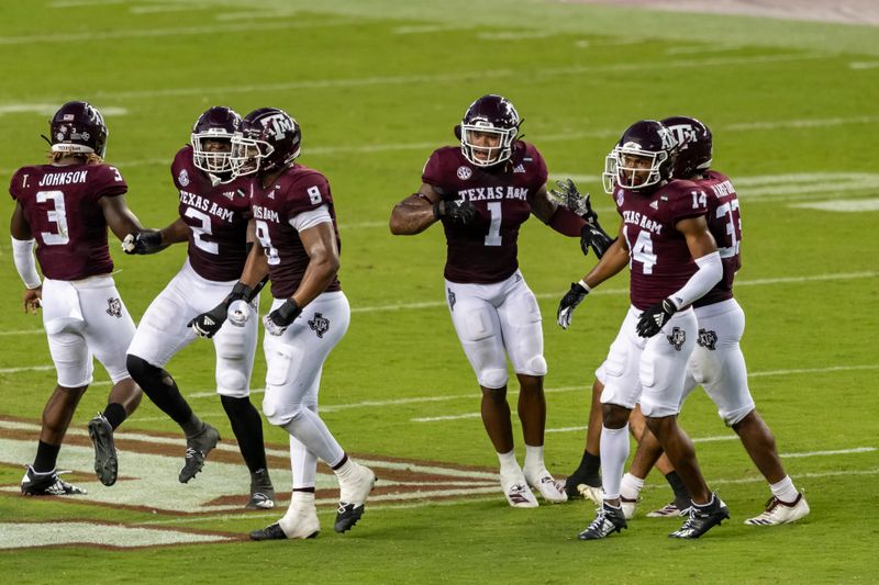 Sep 26, 2020; College Station, Texas, USA;  Texas A&M Aggies linebacker Buddy Johnson (1) celebrates with teammates after a tackle for a loss against the Vanderbilt Commodores during the first half at Kyle Field. Mandatory Credit: Maria Lysaker-USA TODAY Sports