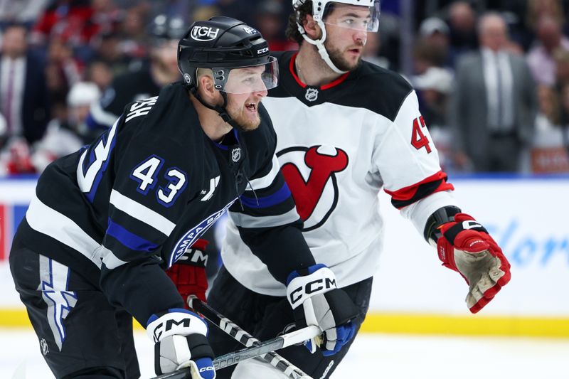 Nov 16, 2024; Tampa, Florida, USA; Tampa Bay Lightning defenseman Darren Raddysh (43) celebrates after scoring a goal against the New Jersey Devils in the third period at Amalie Arena. Mandatory Credit: Nathan Ray Seebeck-Imagn Images