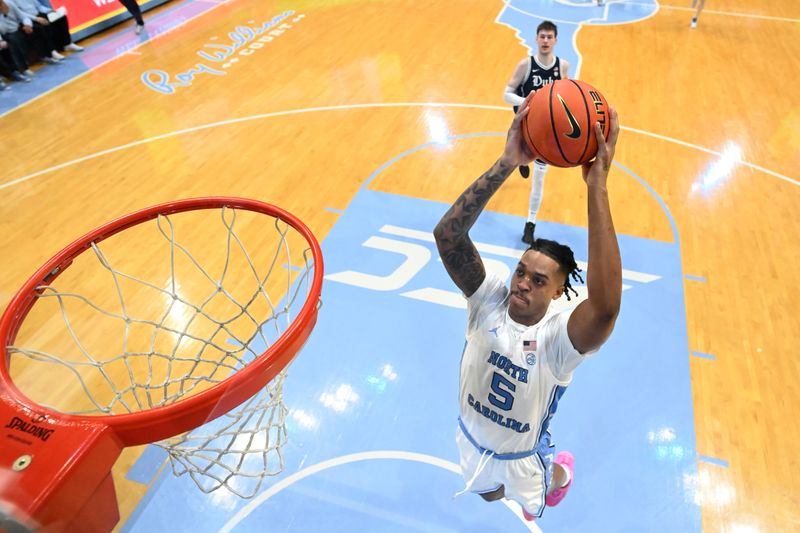 Feb 3, 2024; Chapel Hill, North Carolina, USA; North Carolina Tar Heels forward Armando Bacot (5) scores in the second half at Dean E. Smith Center. Mandatory Credit: Bob Donnan-USA TODAY Sports