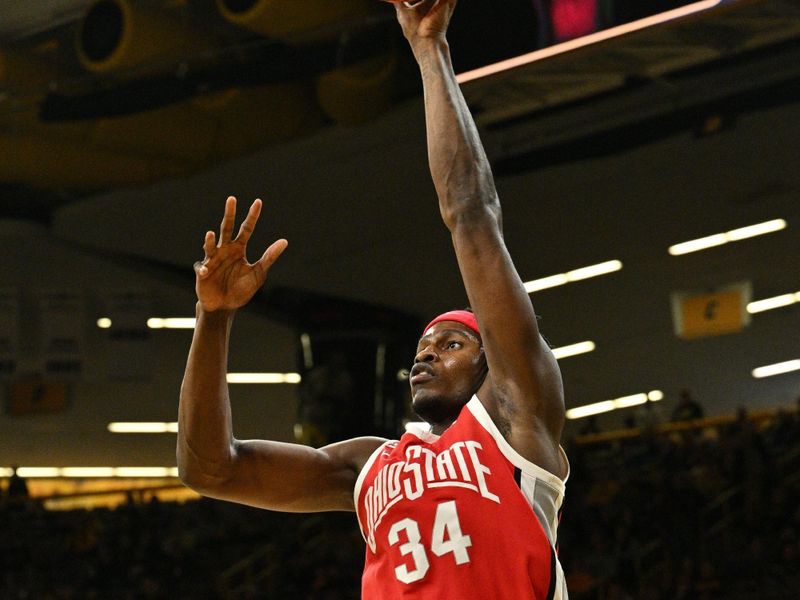 Feb 2, 2024; Iowa City, Iowa, USA; Ohio State Buckeyes center Felix Okpara (34) shoots the ball against the Iowa Hawkeyes during the first half at Carver-Hawkeye Arena. Mandatory Credit: Jeffrey Becker-USA TODAY Sports