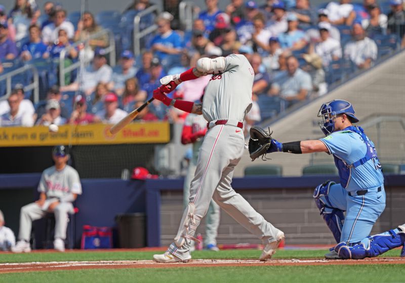 Sep 4, 2024; Toronto, Ontario, CAN; Philadelphia Phillies designated hitter Nick Castellanos (8) hits a single against the Toronto Blue Jays during the first inning at Rogers Centre. Mandatory Credit: Nick Turchiaro-Imagn Images