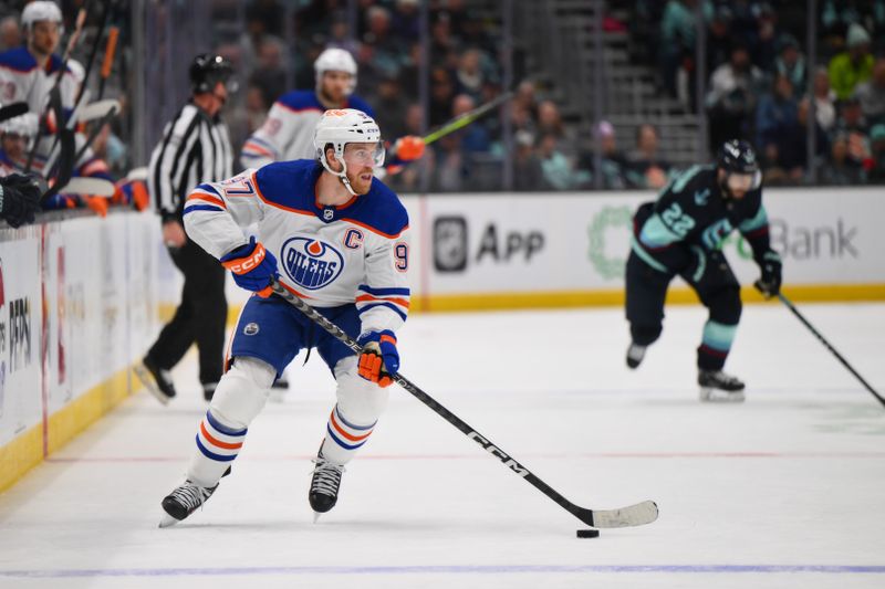 Mar 2, 2024; Seattle, Washington, USA; Edmonton Oilers center Connor McDavid (97) advances the puck against the Seattle Kraken during the third period at Climate Pledge Arena. Mandatory Credit: Steven Bisig-USA TODAY Sports