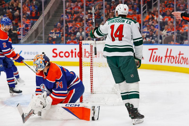 Dec 8, 2023; Edmonton, Alberta, CAN; Minnesota Wild forward Joel Ericksson EK (14) celebrates his goal during the second period against the Edmonton Oilers at Rogers Place. Mandatory Credit: Perry Nelson-USA TODAY Sports.