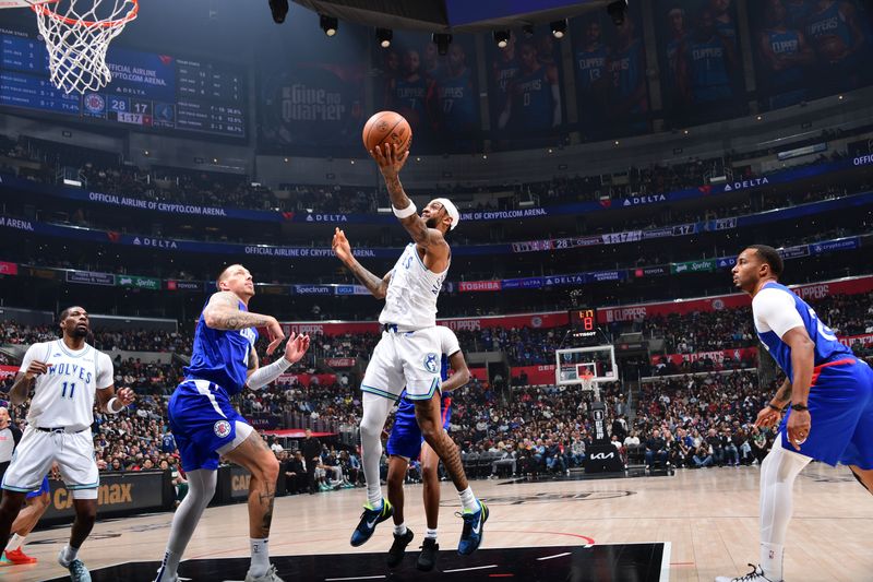 LOS ANGELES, CA - MARCH 12:  Nickeil Alexander-Walker #9 of the Minnesota Timberwolves drives to the basket during the game against the LA Clippers on March 12, 2024 at Crypto.Com Arena in Los Angeles, California. NOTE TO USER: User expressly acknowledges and agrees that, by downloading and/or using this Photograph, user is consenting to the terms and conditions of the Getty Images License Agreement. Mandatory Copyright Notice: Copyright 2024 NBAE (Photo by Adam Pantozzi/NBAE via Getty Images)