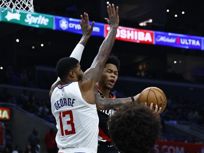 LOS ANGELES, CALIFORNIA - DECEMBER 11:  Anfernee Simons #1 of the Portland Trail Blazers takes a shot against Paul George #13 of the LA Clippers in the second half at Crypto.com Arena on December 11, 2023 in Los Angeles, California.  NOTE TO USER: User expressly acknowledges and agrees that, by downloading and/or using this photograph, user is consenting to the terms and conditions of the Getty Images License Agreement. (Photo by Ronald Martinez/Getty Images)