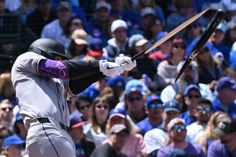May 26, 2025; Chicago, Illinois, USA; Colorado Rockies third baseman Ryan McMahon (24) breaks his bat to fly out during the fourth inning against the Chicago Cubs at Wrigley Field. Mandatory Credit: Patrick Gorski-Imagn Images