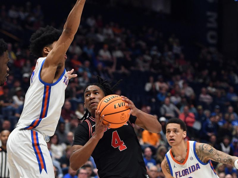 Mar 14, 2024; Nashville, TN, USA; Georgia Bulldogs guard Silas Demary Jr. (4) drives to the basket against Florida Gators guard Zyon Pullin (0) during the second half at Bridgestone Arena. Mandatory Credit: Christopher Hanewinckel-USA TODAY Sports