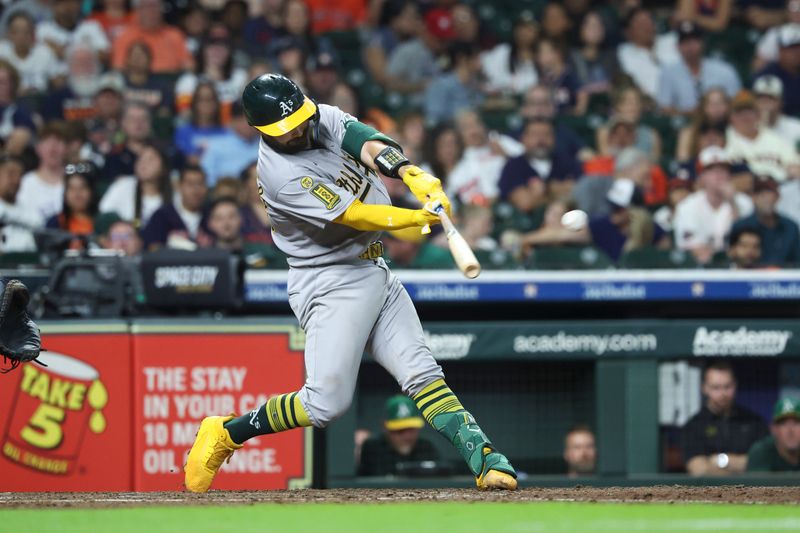 Jul 26, 2025; Houston, Texas, USA; Athletics catcher Shea Langeliers (23) hits a home run during the sixth inning against the Houston Astros at Daikin Park. Mandatory Credit: Troy Taormina-Imagn Images