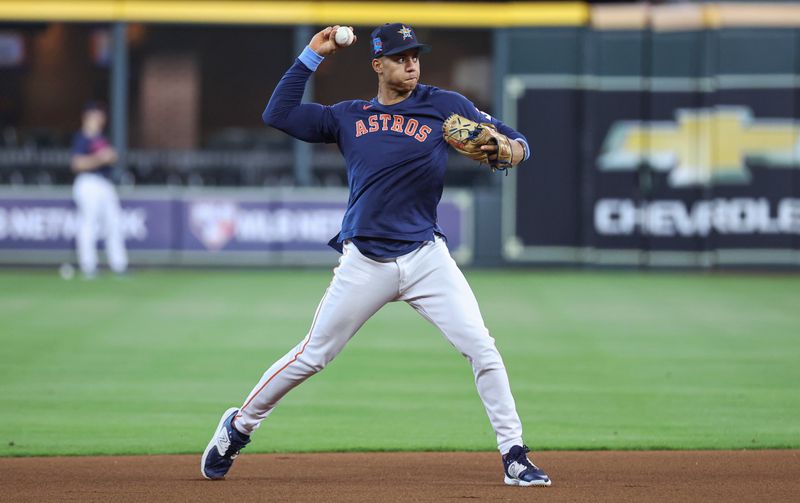 Jun 18, 2023; Houston, Texas, USA; Houston Astros shortstop Jeremy Pena (3) fields ground balls before the game against the Cincinnati Reds at Minute Maid Park. Mandatory Credit: Troy Taormina-USA TODAY Sports