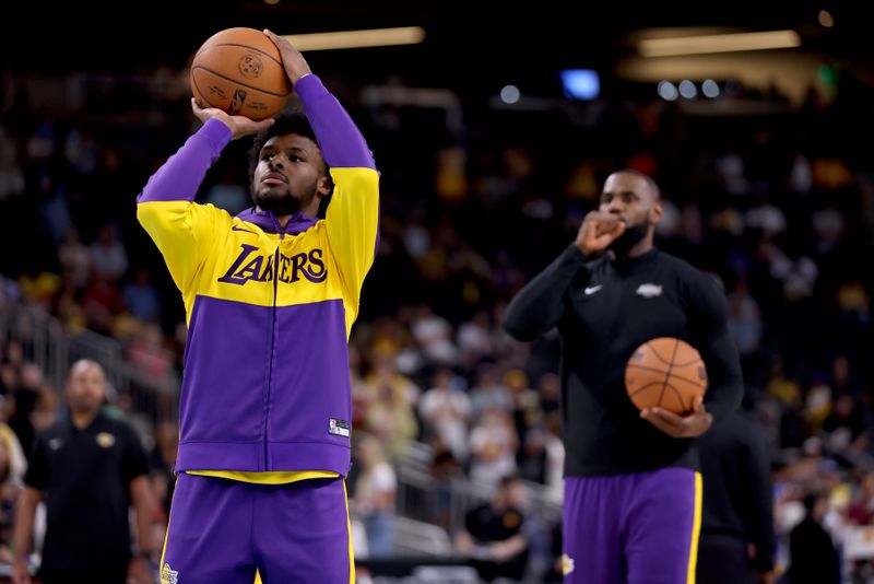 PALM SPRINGS, CALIFORNIA - OCTOBER 06: Bronny James #9 and LeBron James #23 of the Los Angeles Lakers warm up prior to the game against the Phoenix Suns at Acrisure Arena on October 06, 2024 in Palm Springs, California. NOTE TO USER: User expressly acknowledges and agrees that, by downloading and/or using this photograph, user is consenting to the terms and conditions of the Getty Images License Agreement. (Photo by Katelyn Mulcahy/Getty Images)