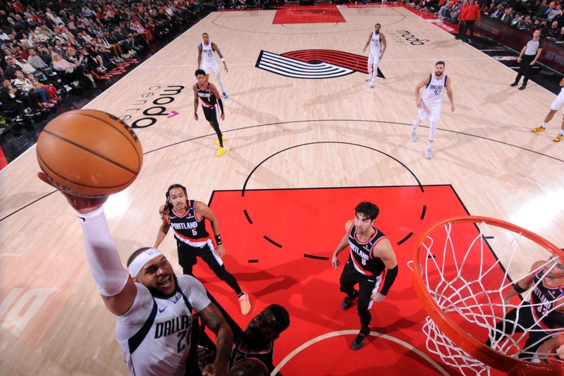 PORTLAND, OR - DECEMBER 1: Daniel Gafford #21 of the Dallas Mavericks dunks the ball during the game against the Portland Trail Blazers on December 1, 2024 at the Moda Center Arena in Portland, Oregon. NOTE TO USER: User expressly acknowledges and agrees that, by downloading and or using this photograph, user is consenting to the terms and conditions of the Getty Images License Agreement. Mandatory Copyright Notice: Copyright 2024 NBAE (Photo by Cameron Browne/NBAE via Getty Images)