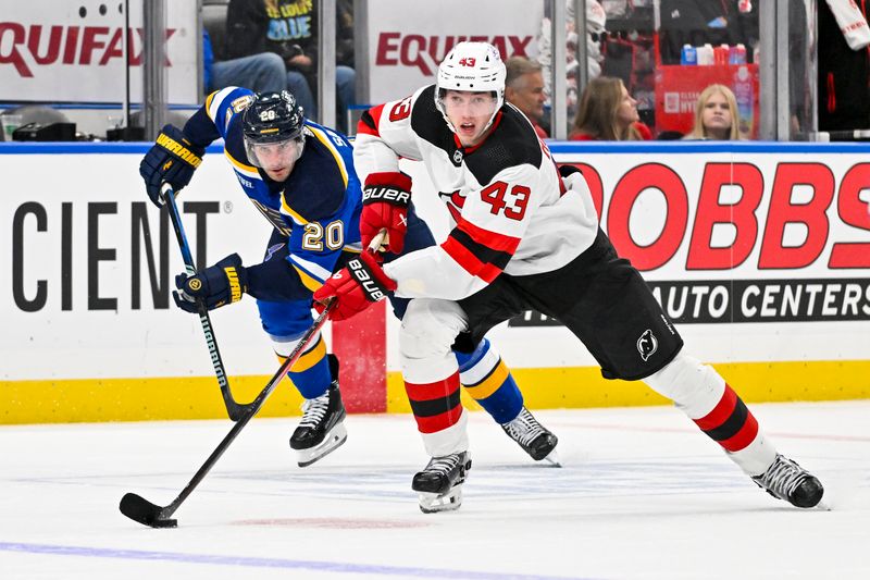 Nov 3, 2023; St. Louis, Missouri, USA;  New Jersey Devils defenseman Luke Hughes (43) controls the puck against the St. Louis Blues during the third period at Enterprise Center. Mandatory Credit: Jeff Curry-USA TODAY Sports