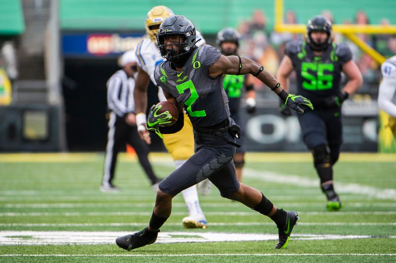 Nov 21, 2020; Eugene, Oregon, USA; Oregon Ducks wide receiver Devon Williams (2) catches a pass for a first down during the second half against the UCLA Bruins at Autzen Stadium. The Ducks won 38-35. Mandatory Credit: Troy Wayrynen-USA TODAY Sports