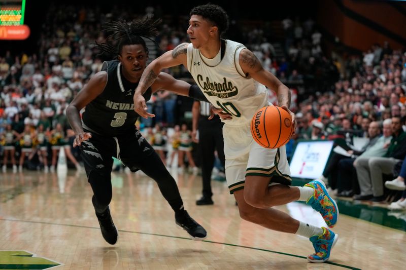 Feb 27, 2024; Fort Collins, Colorado, USA; Colorado State Rams guard Nique Clifford (10) dribbles against Nevada Wolf Pack guard Tyler Rolison (3) during the second half at Moby Arena. Mandatory Credit: Michael Madrid-USA TODAY Sports