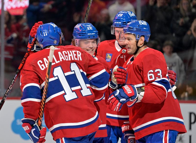 Sep 29, 2022; Montreal, Quebec, CAN; Montreal Canadiens forward Brendan Gallagher (11) celebrates with forward Brendan Gallagher (11) and forward Evgenii Dadonov (63) after scoring a goal against the Winnipeg Jets during the third period at the Bell Centre. Mandatory Credit: Eric Bolte-USA TODAY Sports