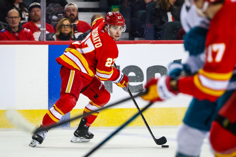 Jan 31, 2026; Calgary, Alberta, CAN; Calgary Flames right wing Matt Coronato (27) controls the puck against the San Jose Sharks during the second period at Scotiabank Saddledome. Mandatory Credit: Sergei Belski-Imagn Images