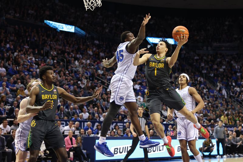 Feb 20, 2024; Provo, Utah, USA; Baylor Bears guard Miro Little (1) goes to the basket against Brigham Young Cougars forward Fousseyni Traore (45) during the first half at Marriott Center. Mandatory Credit: Rob Gray-USA TODAY Sports