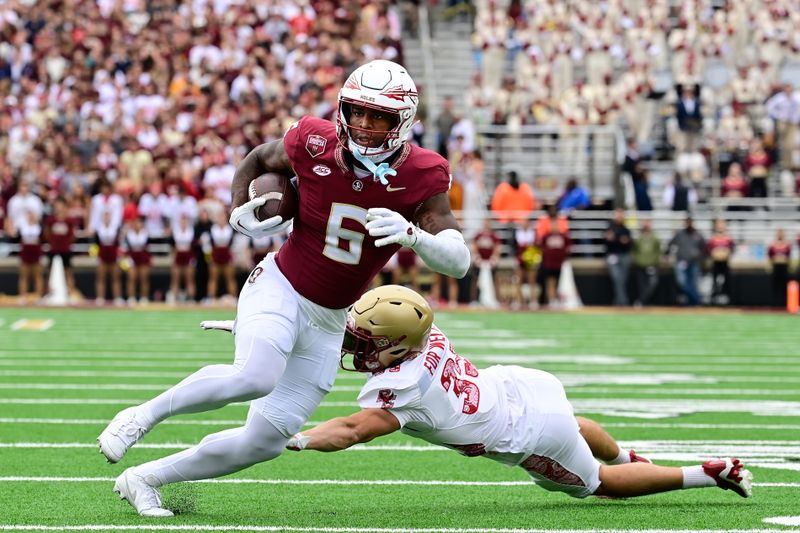 Sep 16, 2023; Chestnut Hill, Massachusetts, USA; Florida State Seminoles tight end Jaheim Bell (6) breaks a tackle by Boston College Eagles defensive back John Pupel (35) and runs for a touchdown during the first half at Alumni Stadium. Mandatory Credit: Eric Canha-USA TODAY Sports