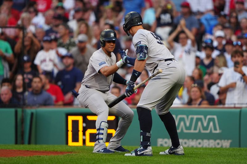 Jul 27, 2024; Boston, Massachusetts, USA; New York Yankees designated hitter Aaron Judge (99) congratulates New York Yankees left fielder Juan Soto (22) for hitting a two-run home run against the Boston Red Sox during the first inning at Fenway Park. Mandatory Credit: Gregory Fisher-USA TODAY Sports