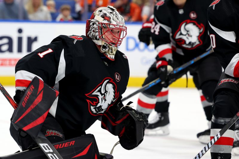 Nov 3, 2023; Buffalo, New York, USA;  Buffalo Sabres goaltender Ukko-Pekka Luukkonen (1) looks for the puck during the first period against the Philadelphia Flyers at KeyBank Center. Mandatory Credit: Timothy T. Ludwig-USA TODAY Sports