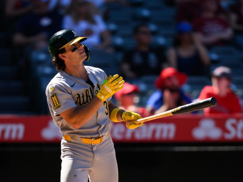 Sep 7, 2025; Anaheim, California, USA; Athletics right fielder Colby Thomas (32) hits a sacrifice fly to tie the game against the Los Angeles Angels during the eighth inning at Angel Stadium. Mandatory Credit: William Liang-Imagn Images