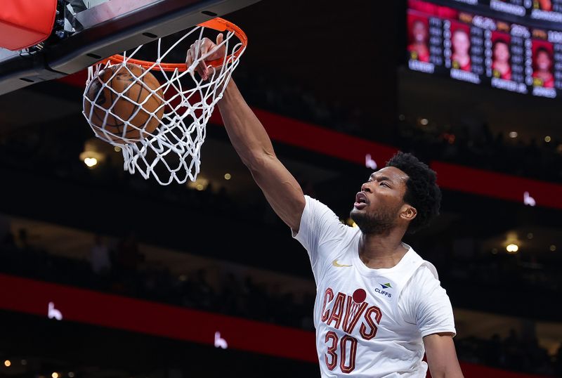 ATLANTA, GEORGIA - MARCH 06:  Damian Jones #30 of the Cleveland Cavaliers dunks against the Atlanta Hawks during the second quarter at State Farm Arena on March 06, 2024 in Atlanta, Georgia.  NOTE TO USER: User expressly acknowledges and agrees that, by downloading and/or using this photograph, user is consenting to the terms and conditions of the Getty Images License Agreement.  (Photo by Kevin C. Cox/Getty Images)