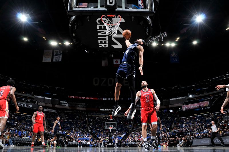 ORLANDO, FL - MARCH 21: Jalen Suggs #4 of the Orlando Magic dunks the ball during the game against the New Orleans Pelicans on March 21, 2024 at Amway Center in Orlando, Florida. NOTE TO USER: User expressly acknowledges and agrees that, by downloading and or using this photograph, User is consenting to the terms and conditions of the Getty Images License Agreement. Mandatory Copyright Notice: Copyright 2024 NBAE (Photo by Fernando Medina/NBAE via Getty Images)