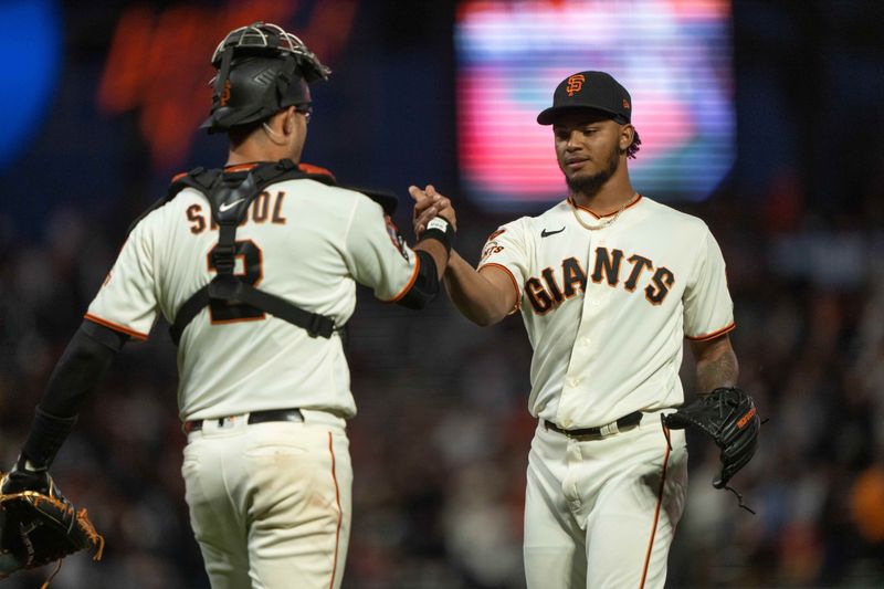 Sep 10, 2023; San Francisco, California, USA;  San Francisco Giants relief pitcher Camilo Doval (75) celebrates with catcher Blake Sabol (2) after defeating the Colorado Rockies at Oracle Park. Mandatory Credit: Stan Szeto-USA TODAY Sports