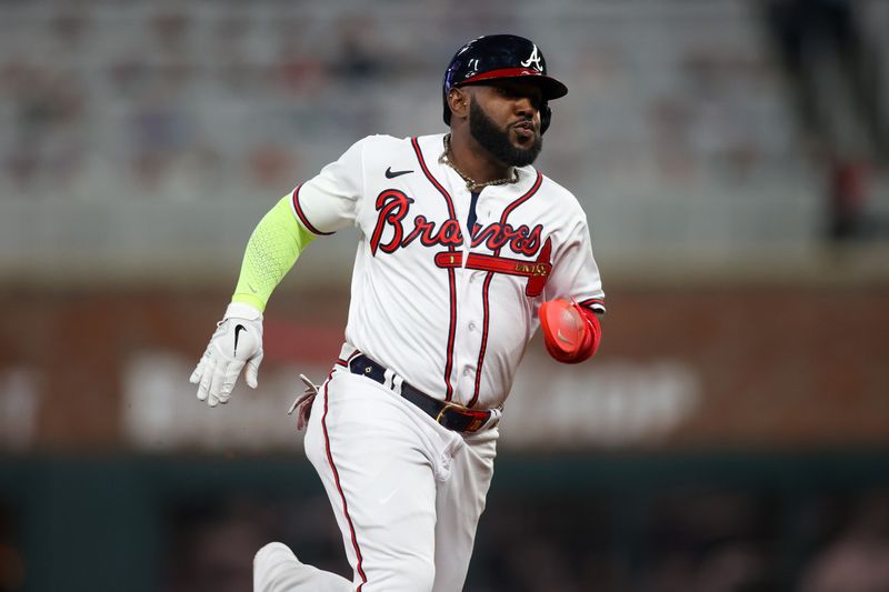 Apr 11, 2023; Atlanta, Georgia, USA; Atlanta Braves designated hitter Marcell Ozuna (20) runs to third against the Cincinnati Reds in the fourth inning at Truist Park. Mandatory Credit: Brett Davis-USA TODAY Sports
