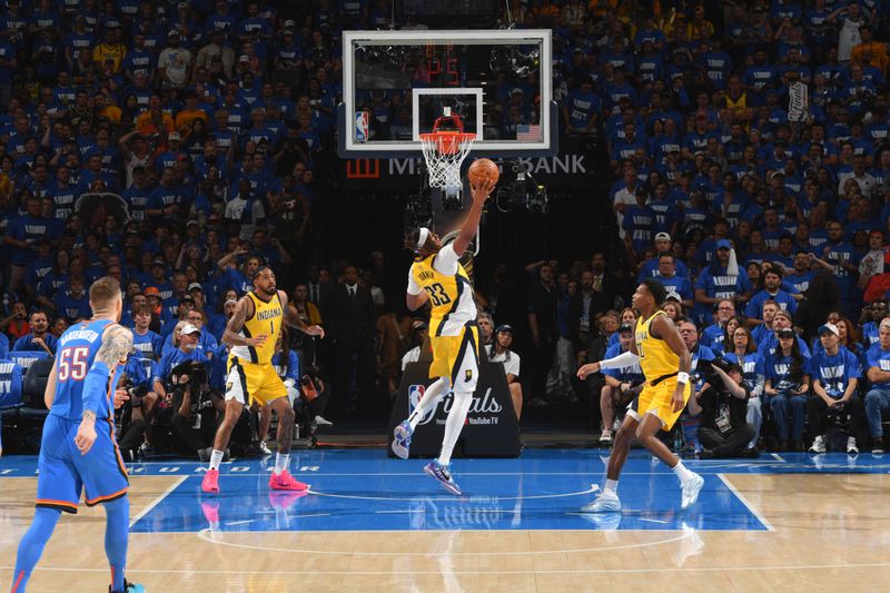 OKLAHOMA CITY, OK - JUNE 8:  Myles Turner #33 of the Indiana Pacers rebounds the ball during the game against the Oklahoma City Thunder during Game Two of the 2025 NBA Finals on June 8, 2025 at Paycom Center in Oklahoma City, Oklahoma. NOTE TO USER: User expressly acknowledges and agrees that, by downloading and or using this photograph, User is consenting to the terms and conditions of the Getty Images License Agreement. Mandatory Copyright Notice: Copyright 2025 NBAE (Photo by Jesse D. Garrabrant/NBAE via Getty Images)