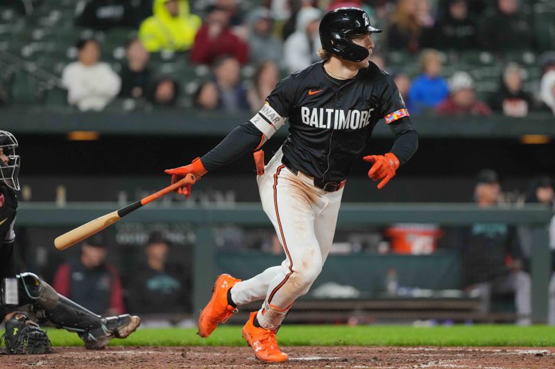 May 10, 2024; Baltimore, Maryland, USA; Baltimore Orioles shortstop Gunnar Henderson (2) doubles to drive in a run in the seventh inning against the Arizona Diamondbacks at Oriole Park at Camden Yards. Mandatory Credit: Mitch Stringer-USA TODAY Sports