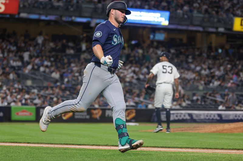 May 21, 2024; Bronx, New York, USA; Seattle Mariners first baseman Ty France (23) runs the bases after hitting a solo home run against New York Yankees relief pitcher Dennis Santana (53) during the seventh inning at Yankee Stadium. Mandatory Credit: Vincent Carchietta-USA TODAY Sports