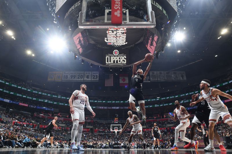 LOS ANGELES, CA - APRIL 10: Brandon Boston Jr. #4 of the LA Clippers drives to the basket during the game against the Phoenix Suns on April 10, 2024 at Crypto.Com Arena in Los Angeles, California. NOTE TO USER: User expressly acknowledges and agrees that, by downloading and/or using this Photograph, user is consenting to the terms and conditions of the Getty Images License Agreement. Mandatory Copyright Notice: Copyright 2024 NBAE (Photo by Adam Pantozzi/NBAE via Getty Images)