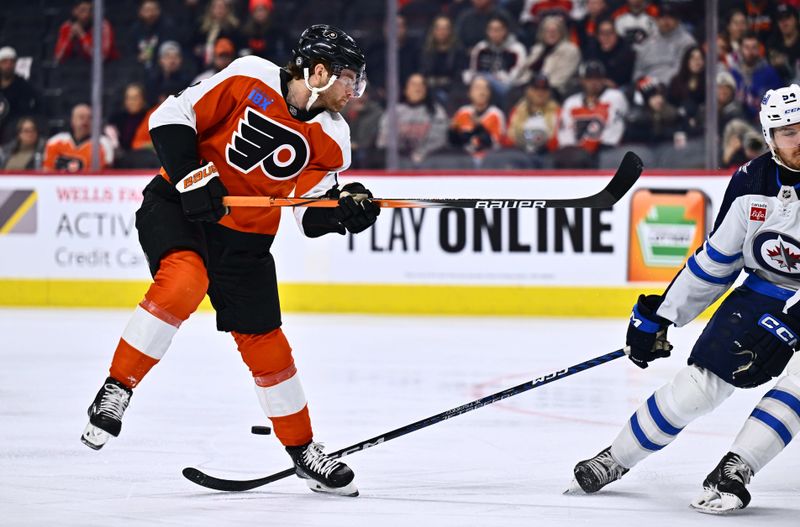 Feb 8, 2024; Philadelphia, Pennsylvania, USA; Philadelphia Flyers defenseman Cam York (8) loses control of the puck against Winnipeg Jets defenseman Dylan Samberg (54) in the first period at Wells Fargo Center. Mandatory Credit: Kyle Ross-USA TODAY Sports