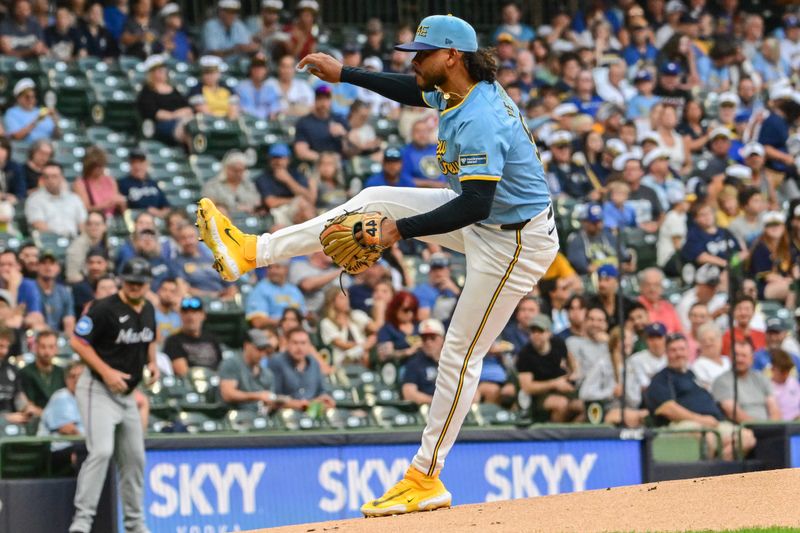 Jul 26, 2024; Milwaukee, Wisconsin, USA;  Milwaukee Brewers starting pitcher Freddy Peralta (51) pitches in the first inning against the Miami Marlins at American Family Field. Mandatory Credit: Benny Sieu-USA TODAY Sports