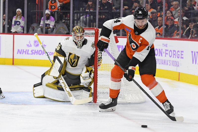 Nov 25, 2024; Philadelphia, Pennsylvania, USA; Philadelphia Flyers center Sean Couturier (14) passes the puck against Vegas Golden Knights goaltender Ilya Samsonov (35) during the first period at Wells Fargo Center. Mandatory Credit: Eric Hartline-Imagn Images