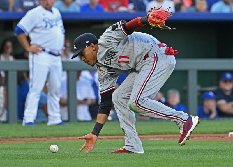 Jul 29, 2023; Kansas City, Missouri, USA;  Minnesota Twins third baseman Jorge Polanco (11) attempts to field a ground ball during the second inning against the Kansas City Royals at Kauffman Stadium. Mandatory Credit: Peter Aiken-USA TODAY Sports