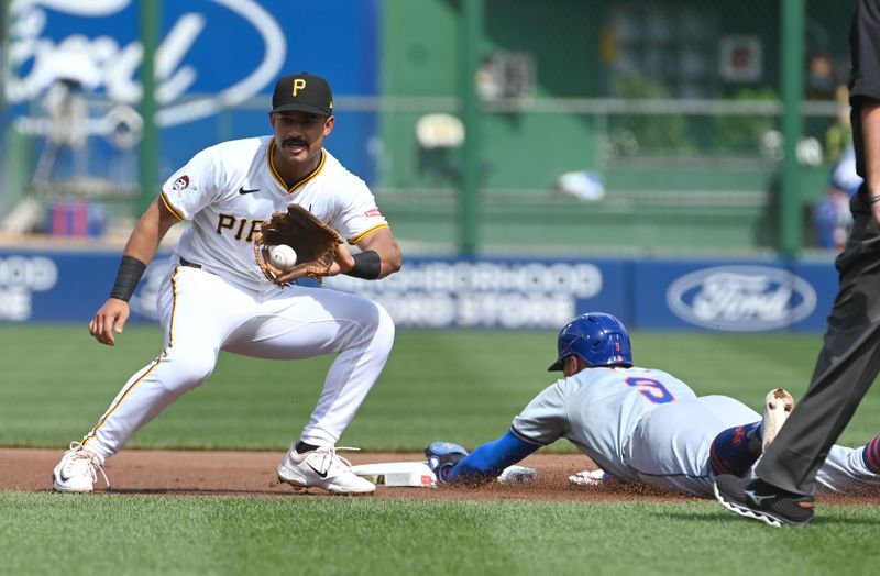 Jul 6, 2024; Pittsburgh, Pennsylvania, USA;  New York Mets base runner Brandon Nimmo (9) steals second base as Pittsburgh Pirates second baseman Nick Gonzales (39) applies the tag durting the first inningmat PNC Park. Mandatory Credit: Philip G. Pavely-USA TODAY Sports