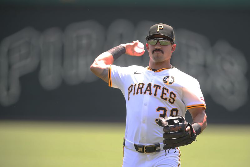 Aug 10, 2025; Pittsburgh, Pennsylvania, USA;  Pittsburgh Pirates second baseman Nick Gonzales (39) warms up before the game against the Cincinnati Reds at PNC Park. Mandatory Credit: Charles LeClaire-Imagn Images