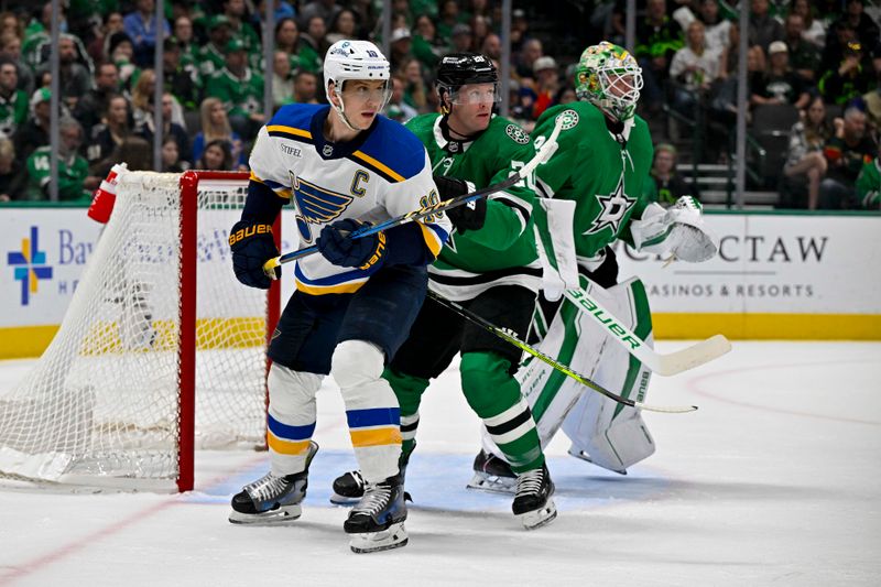 Apr 17, 2024; Dallas, Texas, USA; St. Louis Blues center Brayden Schenn (10) and Dallas Stars defenseman Ryan Suter (20) battle for position in front of goaltender Jake Oettinger (29) during the first period at the American Airlines Center. Mandatory Credit: Jerome Miron-USA TODAY Sports